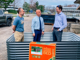 Matt Epstein, manager of the Montvale Farmstand, joins Mayor Mike Ghassali and Administrator Joe Voytus inside one of the 40 raised-bed containers planned for the borough’s new community garden. Photo by Mike Olohan.