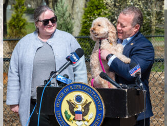 Westwood Councilwoman Erin Collins hosts Rep. Josh Gottheimer and his dog Rosie at Westvale Park on April 7, during Animal Cruelty Prevention Month. Gottheimer outlined new federal proposals targeting gaps in how animal abuse cases are prosecuted, particularly when they cross state lines or occur on federal property. John Snyder photo.