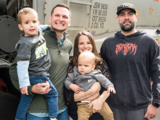 Birthday surprise: River Vale residents Philip and Karina Misklow pose with sons Rocco, left, and Vito alongside Buldo Brothers driver Carlos Gomez during a May 30 birthday surprise for Rocco, whose love of garbage trucks inspired a special visit from the sanitation company. Gomez, who services the neighborhood, volunteered to stop by on his day off with a Buldo Brothers truck. Photo by John Snyder.