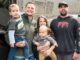 Birthday surprise: River Vale residents Philip and Karina Misklow pose with sons Rocco, left, and Vito alongside Buldo Brothers driver Carlos Gomez during a May 30 birthday surprise for Rocco, whose love of garbage trucks inspired a special visit from the sanitation company. Gomez, who services the neighborhood, volunteered to stop by on his day off with a Buldo Brothers truck. Photo by John Snyder.
