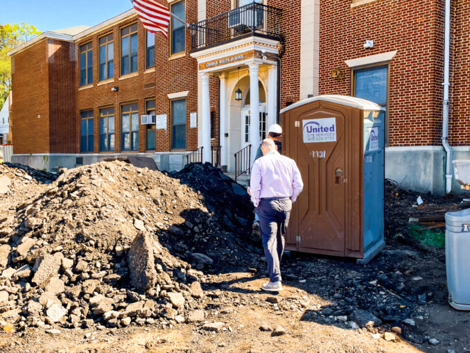Asbestos remediation at George G. White Middle School is “conditionally complete,” Superintendent Rob Lombardy told residents May 2, though additional areas may still require attention as demolition continues inside the century-old building. Michael Olohan photo.