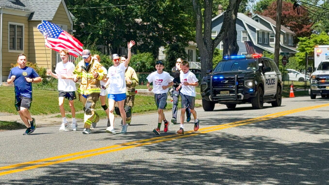 Students and first responders take part in Westwood Regional Middle School’s inaugural Student Torch Run in support of Special Olympics New Jersey.
