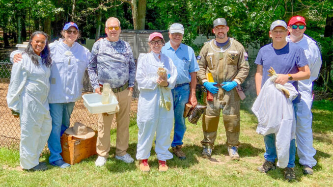 Proud members of the Northeast New Jersey Beekeepers Association gather during the 2026 Hive Tour at the Centennial Park Apiary in Emerson. Pictured, from left, are Ruth Pender-Rosales, Cynthia Rodriguez, John Vervoort, Teddi Oster, John Gaut, Sean Flannelly, Deon Minnaar, and Greg Matthews. Not pictured: Jill Albano, who organized the tour and took the photograph.