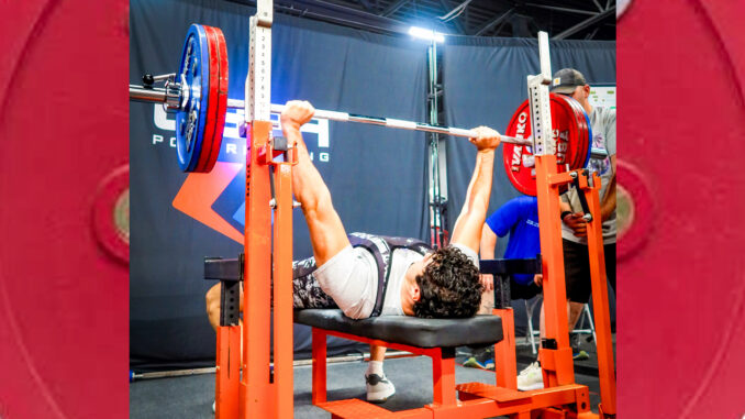 RECORD LIFT: Chase Miller, a 2024 Pascack Hills graduate, bench-presses 357.5 pounds at the USPA Summer Showdown in Latham, New York, on July 12. The lift set a New Jersey raw bench press record in the Junior Men (18–19) 100-kilogram division and earned Miller a gold medal.