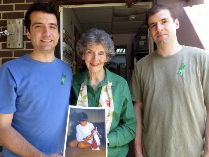 GROWING THE MOVEMENT: Rosemarie Birri D'Alessandro holds a picture of her daughter Joan with sons Michael and John in 2019. File photo.