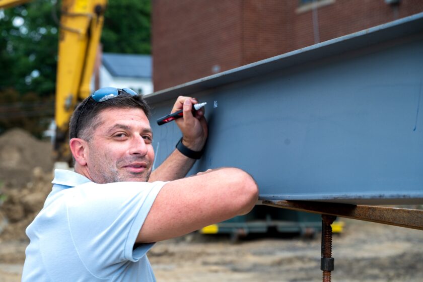 On July 24, 2026 Hillsdale Board of Education President Kevin Donatello is the first to sign the steel beam that will symbolically tie together the new addition at George G. White Middle School. John Snyder photo.