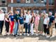 Focus on the future: Schools Superintendent Robert Lombardy, second from right, and district officials past and present after signing a ceremonial steel beam marking a milestone in the renovation and expansion of George G. White Middle School on July 24, 2026. John Snyder photo.