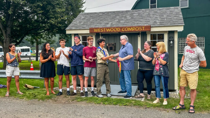 Westwood Troop 350 Eagle Scout Nicholas Doell cuts the ribbon officially opening the borough’s pilot compost program, the culmination of nearly a year and a half of planning and construction. From left are Claudia Gonzales-Doell, Council President Lauren Letizia, Dominick Paniscotti, Nicholas Hawrylczak, William Harrahy, Doell, Mayor Raymond Arroyo, Councilwoman Erin Collins, Councilwoman Beth Dell, and Keith Doell. Joann Paniscotti photo.