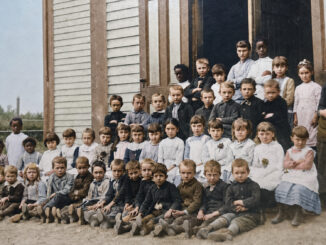 The students of Park Ridge posed for this photograph outside their schoolhouse in the late 1880s. The first Monday of September meant back-to-school time. (Colorized photo)
