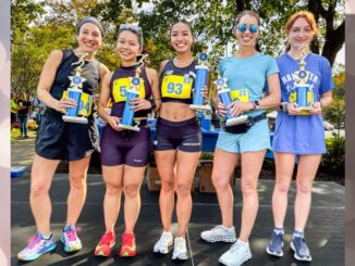 Women’s winners show off their trophies at a previous Haworth 5K. This year’s race will bring runners back to the borough.