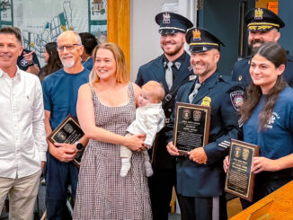 A happy reunion at Hillsdale Borough Hall: Parents Alyssa and Joshua Boone, with baby Marshall, join Police Chief Travis Woods, Sgt. David Sayers, Officer Dominick Speciale and EMTs Jim Clark and Rachel Brunn as the borough honors the responders who helped deliver Marshall at home April 6. Anthony DeRosa photo.