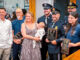 A happy reunion at Hillsdale Borough Hall: Parents Alyssa and Joshua Boone, with baby Marshall, join Police Chief Travis Woods, Sgt. David Sayers, Officer Dominick Speciale and EMTs Jim Clark and Rachel Brunn as the borough honors the responders who helped deliver Marshall at home April 6. Anthony DeRosa photo.