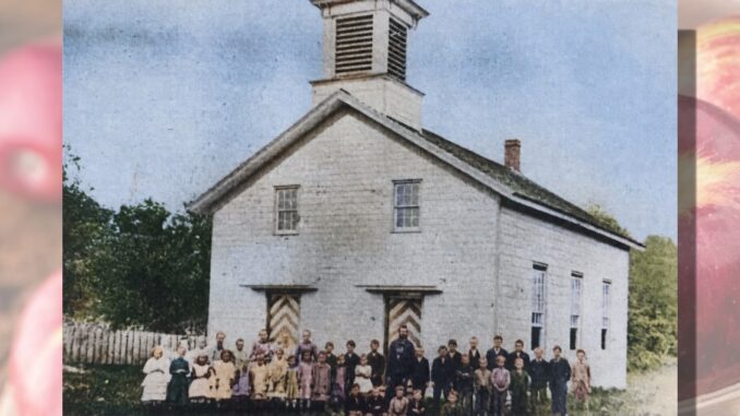 The student body of Hillsdale’s first school with teacher William W. Banta. The young teacher was in charge of this entire group in the one-room schoolhouse.