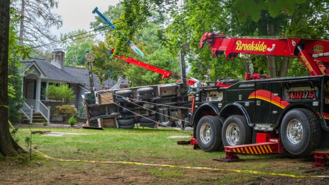 Heavy recovery equipment surrounds an overturned crane on Sunny Hill Terrace in River Vale Thursday, Sept. 17, after it toppled during tree removal, damaging two homes. No injuries were reported. Photo by John Snyder/Pascack Press