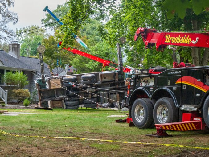 Heavy recovery equipment surrounds an overturned crane on Sunny Hill Terrace in River Vale Thursday, Sept. 17, after it toppled during tree removal, damaging two homes. No injuries were reported. Photo by John Snyder/Pascack Press