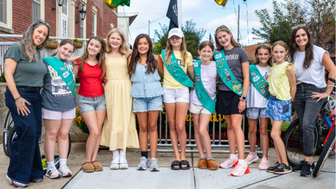 From left: Troop 98178 co-leader Jeanine Farfalla, Siena Tricario, Isabella DeFabrizio, Victoria Horton, Rebecca Rodriguez, Lainey Joy Johnson, Harper McCormack, Seraphina Katz, Hayden Hogan, Toby Kalman and co-leader Jamie Hogan celebrate the troop’s new bike rack and Bronze Awards at Westwood’s Sgt. Christopher R. Hrbek Post Office Building on Sept. 13. John Snyder photo.