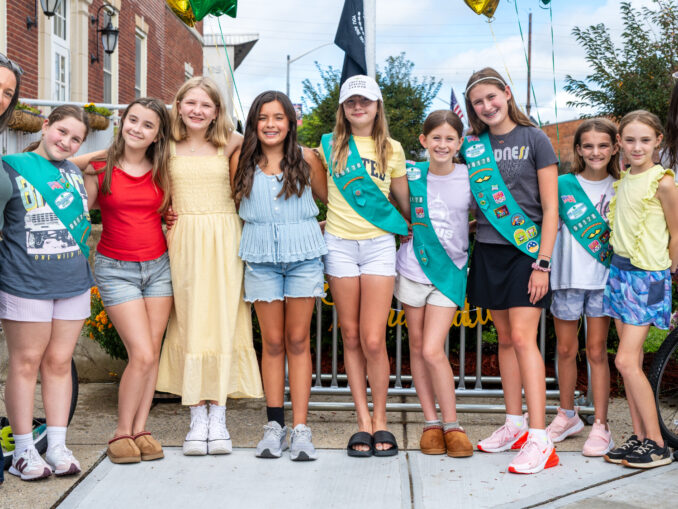 From left: Troop 98178 co-leader Jeanine Farfalla, Siena Tricario, Isabella DeFabrizio, Victoria Horton, Rebecca Rodriguez, Lainey Joy Johnson, Harper McCormack, Seraphina Katz, Hayden Hogan, Toby Kalman and co-leader Jamie Hogan celebrate the troop’s new bike rack and Bronze Awards at Westwood’s Sgt. Christopher R. Hrbek Post Office Building on Sept. 13. John Snyder photo.