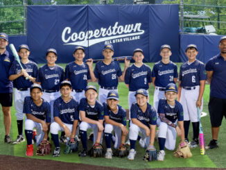 Cooperstown, N.Y., August 2026: Back to front, left to right: Manager Elan Ofeck, Riley Kahn, Connor Smith, Chase Lambert, Maison Mussa, Lincoln Drummond, Mikey Phelan, Matt Baez, Coach Will Odige Jr., Tony Odige, Nick Quinn, Nick Jones, Mason Morris, Liam Sager, and Peyton Calonico. Grit Venom photo.