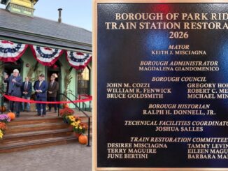 Park Ridge officials and residents celebrate the grand reopening of the borough’s restored 1871 train depot with a ribbon cutting Oct. 20. A new plaque recognizes borough officials, staff, historians and restoration committee members. Photos: Mike Olohan.