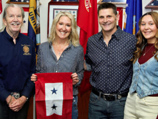 American Legion Post 162 Commander Tom Robinson, from left, presents a two-star Blue Star Service Flag to Shane Svorec, joined by husband Rich and daughter Lainey. The stars honor the Hillsdale couple’s two daughters serving in the U.S. military: Pfc. Destiny Svorec, left, an Army horizontal construction engineer, and AG3 Lainey Svorec, right, a Navy reservist and aerographer’s mate third class. The presentation was made at the post’s Oct. 3 meeting. Zoltán Horváth photo.